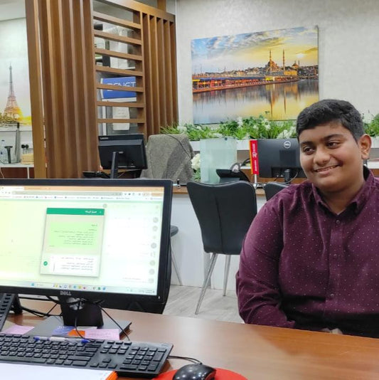 Teen learning through hands-on experience during an onsite visit to a travel agency – The Garden of Knowledge