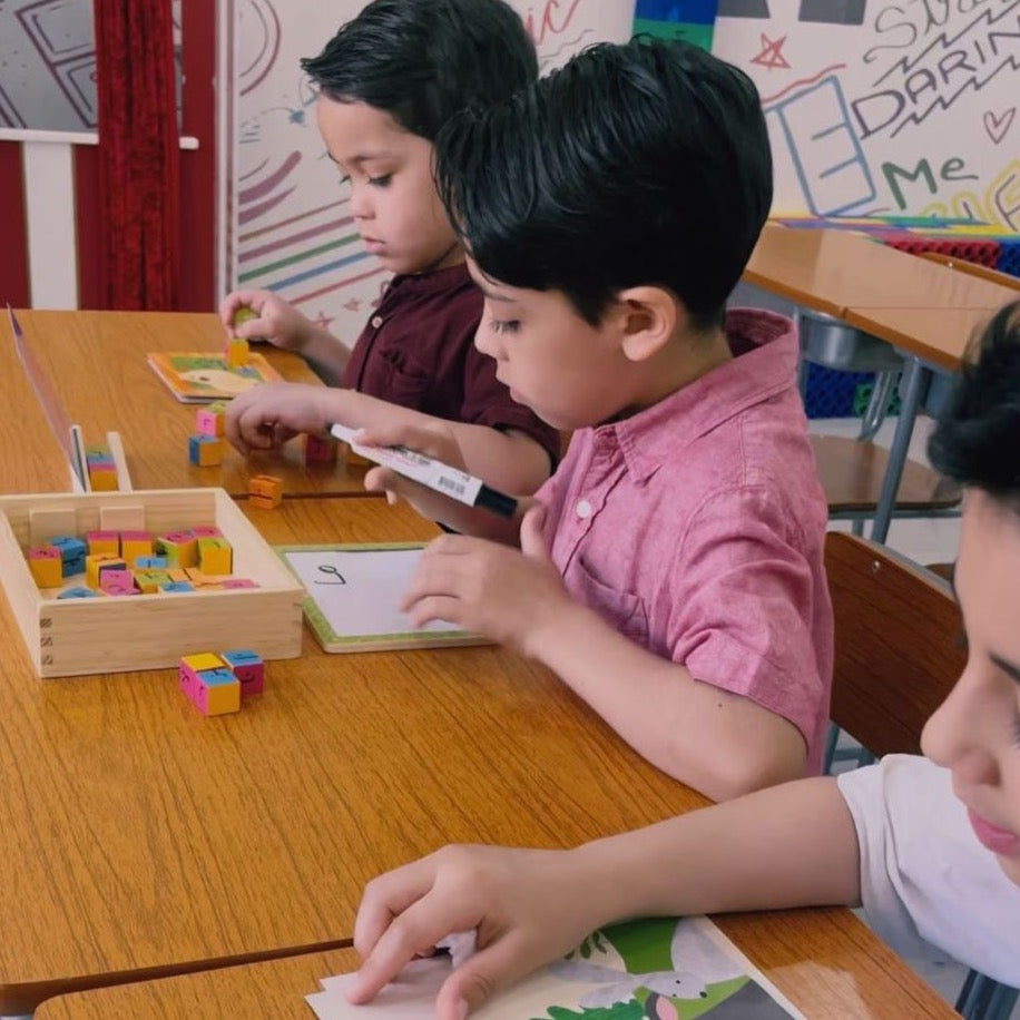 3 primary school boys learning Arabic through interactive games and crafts